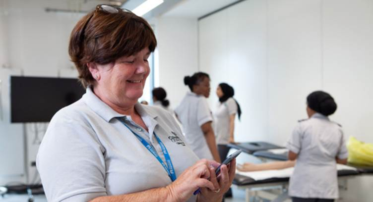 Coventry University lecturer, Jane Rudge, using a Standalone 5G smartphone. Pic credit: Vodafone UK.